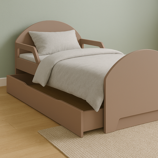 Toddler bed with neutral bedding and a rounded headboard, set against a sage green wall and light wood floor.