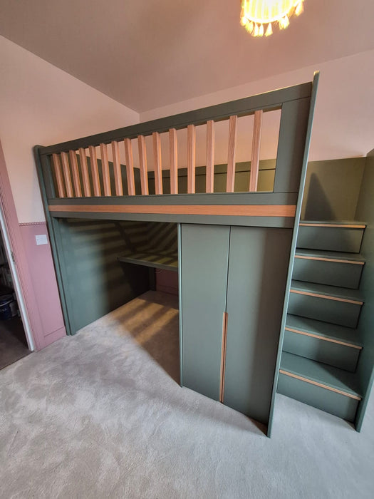 Green loft bed with stairs in a room with pink walls
