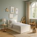 Children's bedroom featuring a white Allie Trundle Bed with a mattress, set in a room with a light green wall, wooden flooring, and a natural color scheme.